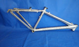 A silver Diamondback Outlook Bicycle Alloy 16-inch mountain bike frame for 26-inch wheels, showing no signs of defects or deformation.