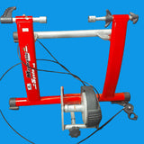 A red and silver magnetic system trainer for bicycles, showing the frame and resistance mechanism.