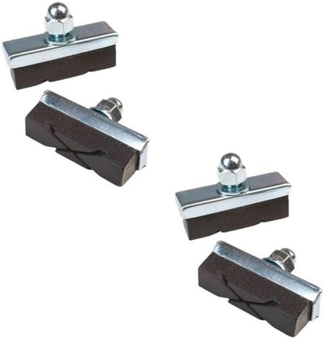 Four brake pads on a white background